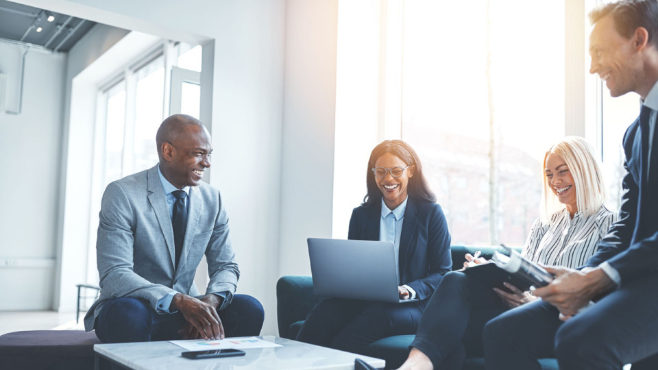 Business teammates smiling during a meeting